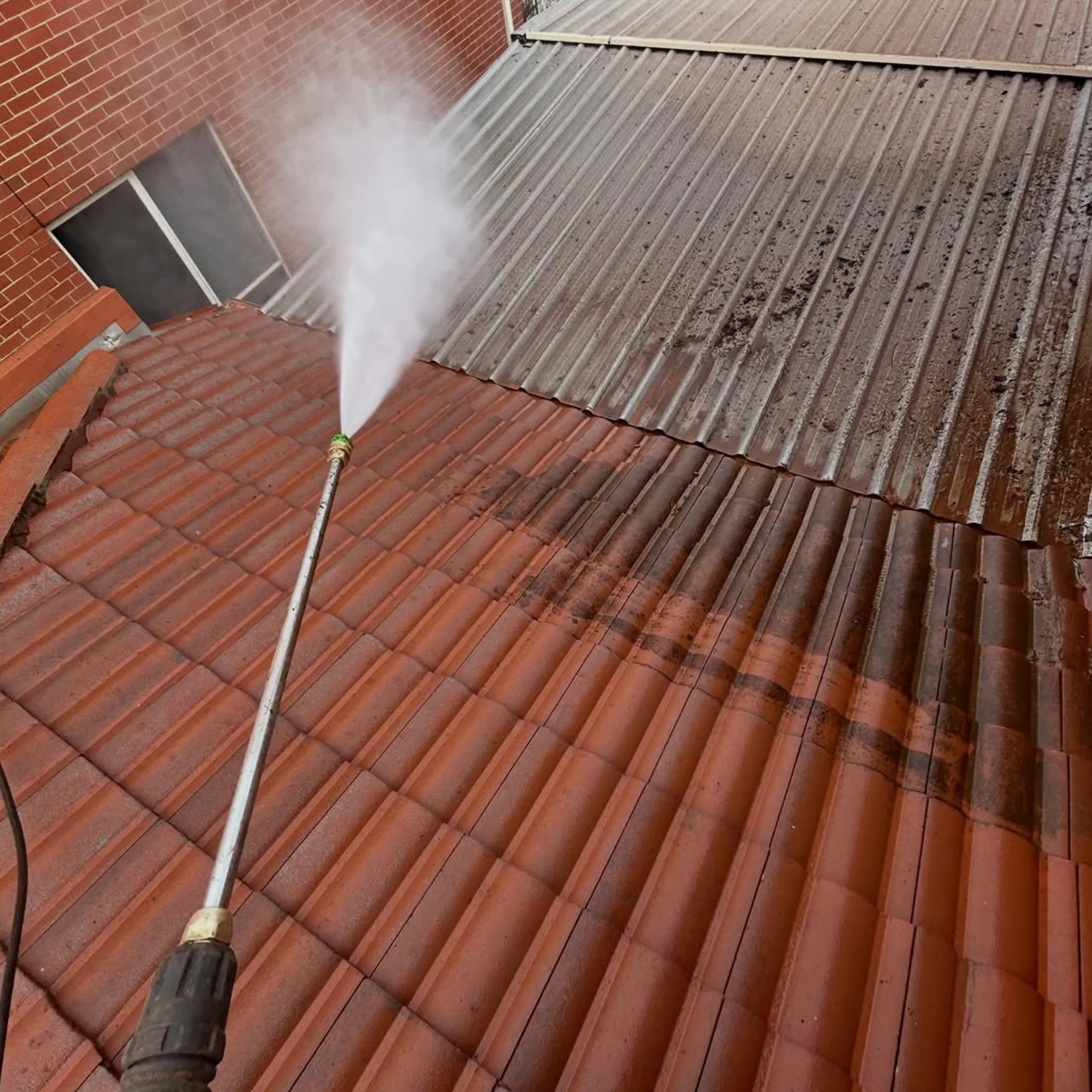 roof cleaning in progress outdoors