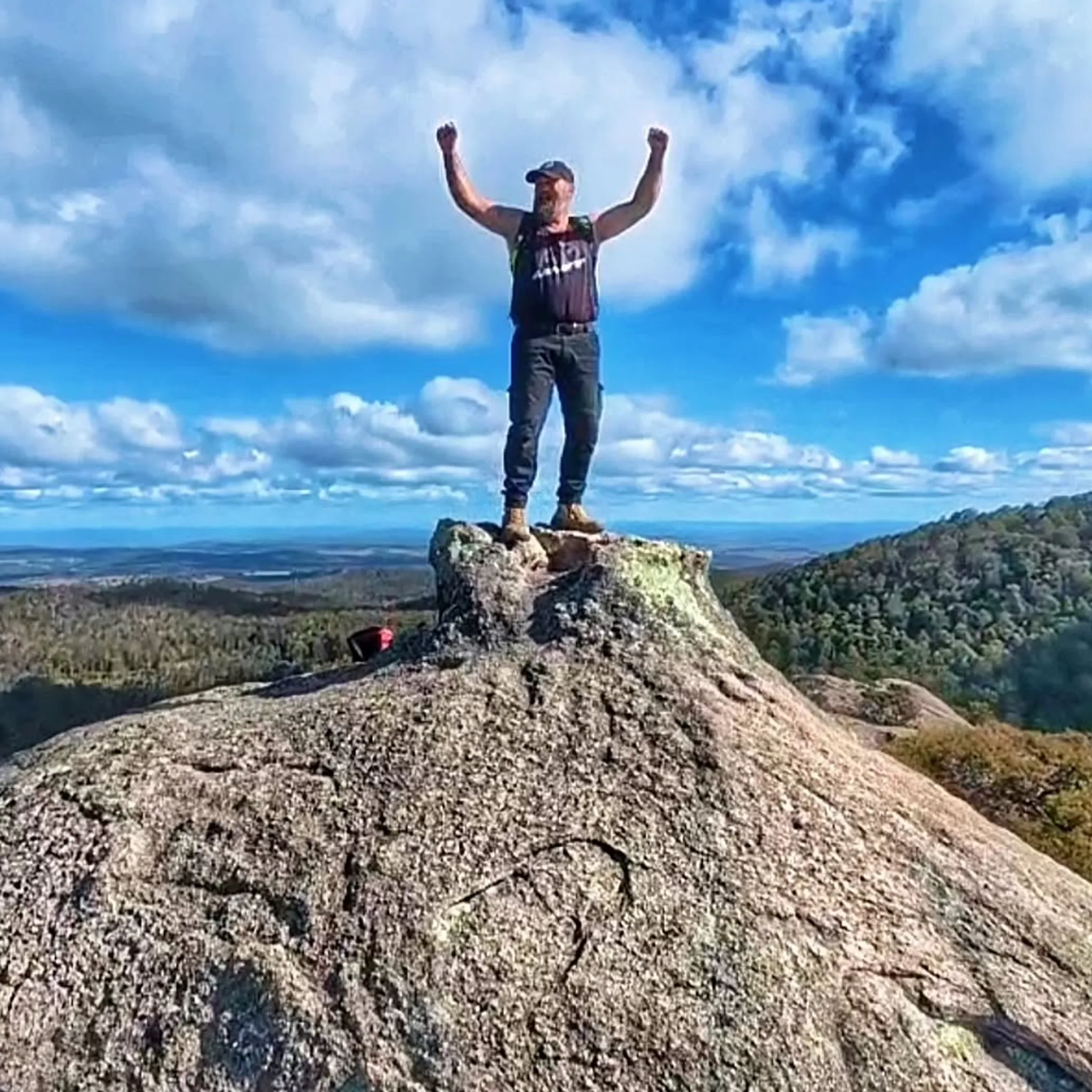 hiker walking on rocky trail