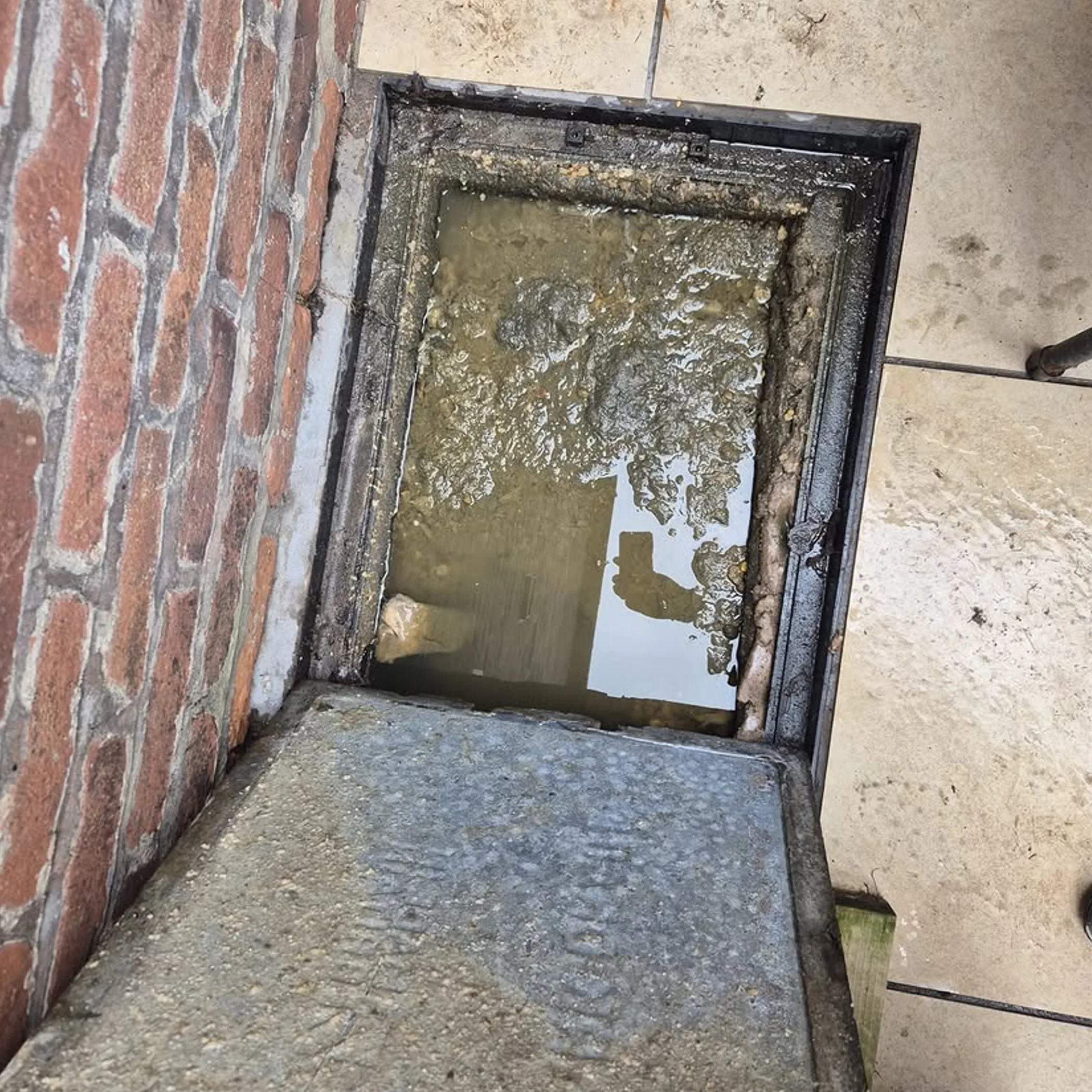overflowing blocked drain