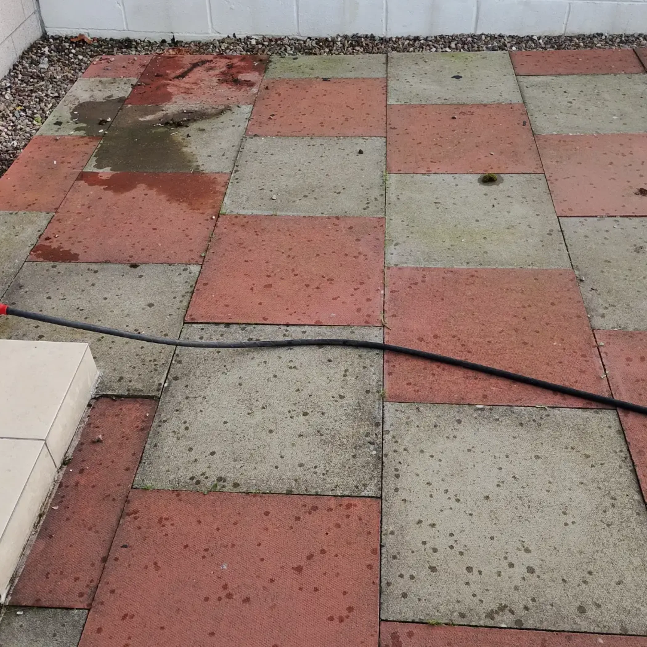 outdoor patio surface being cleaned
