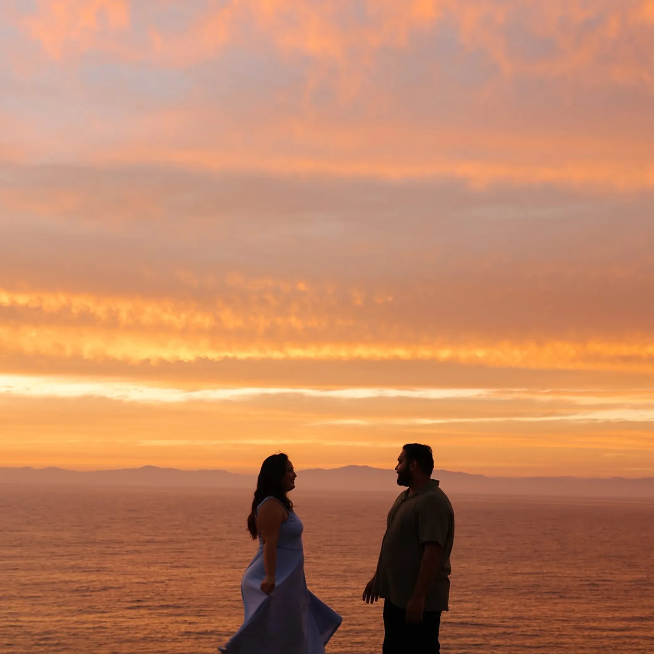 couple in a beach proposal setting